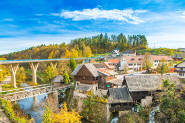 Fototapeta na wymiar Village of Rastoke near Slunj in Croatia, old water mills on waterfalls of Korana river, beautiful countryside landscape 