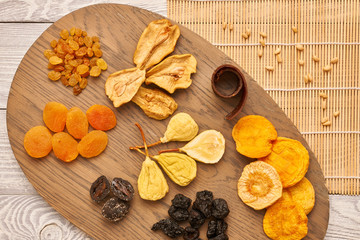 Dried fruits on wooden background