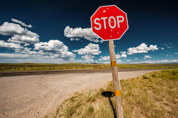 Stop sign on empty highway in Wyoming - 187958292