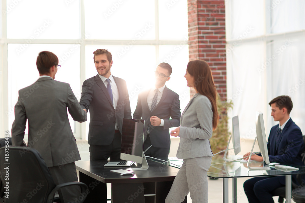 Wall mural business group of five people in the office planning a job