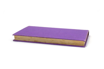 Purple book at an angle, isolated on white