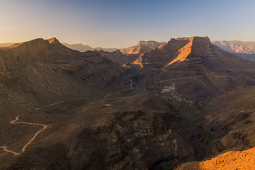 Mountains with canyons during sunset on Gran Canaria island. Retro filtered photography.