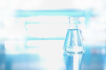 single flask with water in science chemical environment laboratory
