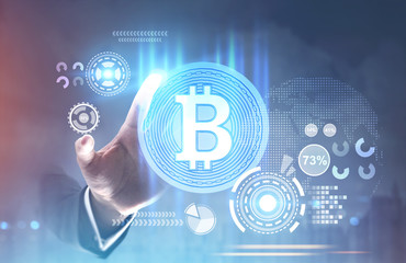 Hand of man reaching for bitcoin hologram, HUD