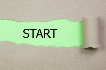 The word start written on torn paper
