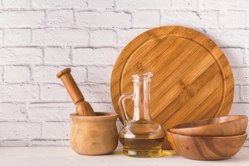 Wooden tableware on a white table.