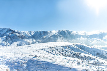 Beautiful Snow-covered mountains in winter in sunny weather