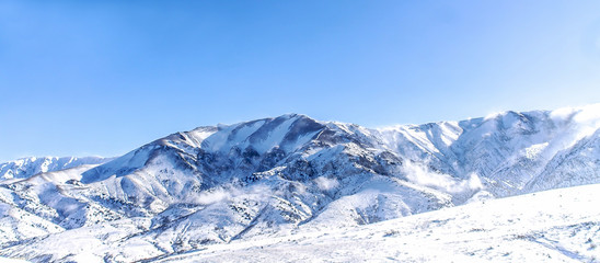 Beautiful Snow-covered mountains in winter in sunny weather