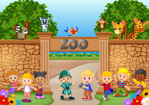 Kids playing at the zoo with zookeeper and animal