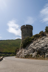 Fototapeta na wymiar Corsica, 27/08/2017: la Torre di Losse, o Torre dell'Osse (1599), una torre genovese in rovina nel comune di Cagnano (Alta Corsica) lungo la strada tortuosa della costa est di Capo Corso