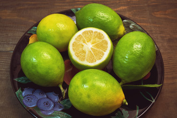 leech lime in black dish on wood background