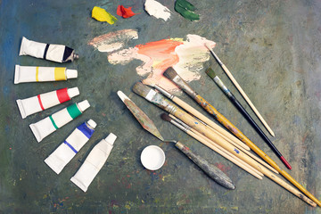 oil paints and paint brushes on a palette