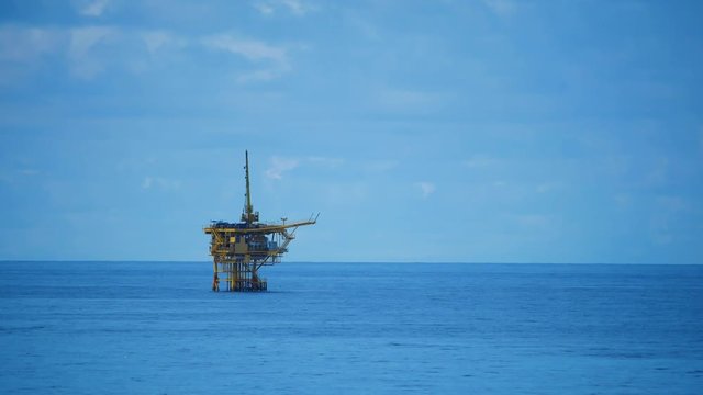 Small offshore platform and storm in the middle of the ocean 
