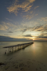 Fototapeta premium Concrete broken bridge in the sea against a vibrant sunrise in Varna, Bulgaria