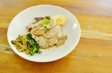 boiled duck meat slice dressing brown sauce with egg on rice