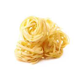Uncooked fettuccine pasta isolated