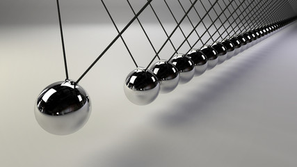 cause and effect concept, infinity steel Newton's cradle on a white background