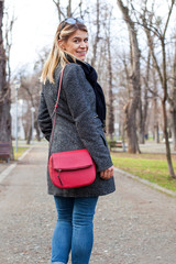 Cheerful young woman in the park