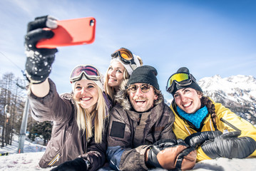 Group of friends having fun on the snow