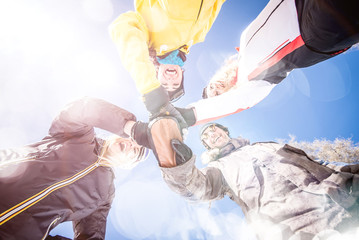 Group of friends having fun on the snow