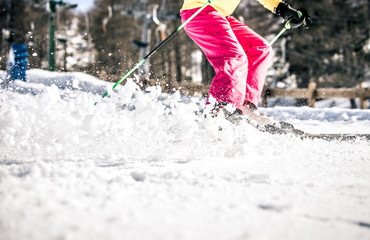 Woman skiing fast close up moment
