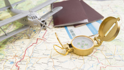 Boarding pass, compass, passport, plane on the map. Idea: Tourism, trip, journey, vacation. airline business. airplane