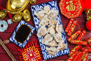 Obraz na płótnie Canvas Chinese Jiaozi new year food, spring festival food on traditional spring festival Spring festival atmosphere and dumplings