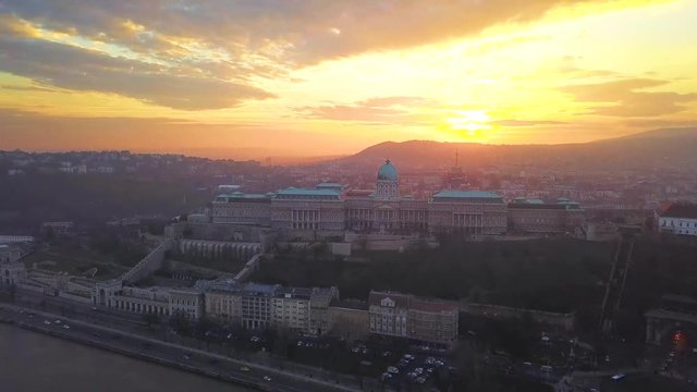 Budapest, Hungary - Aerial drone footage of Buda Castle Royal Palace with beautiful sunset and colorful sky