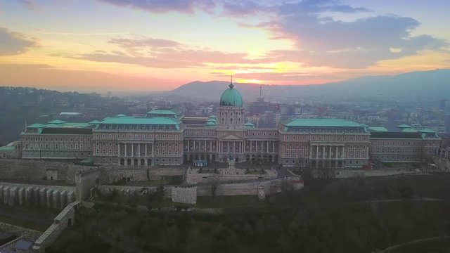 Budapest, Hungary - 4K aerial drone footage of Buda Castle Royal Palace with beautiful sunset and colorful sky