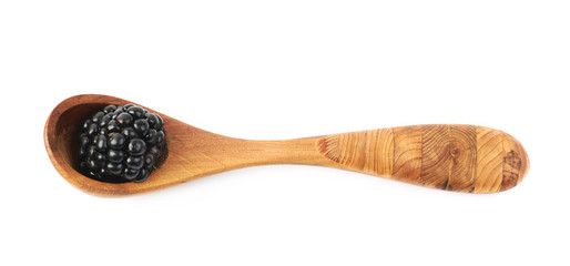 Wooden spoon and blackderry fruit
