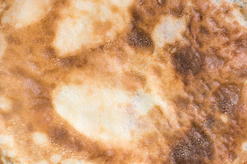 Close up texture of a pancake surface.