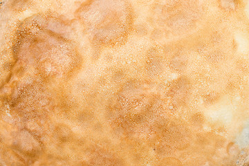 Close up texture of a pancake surface.