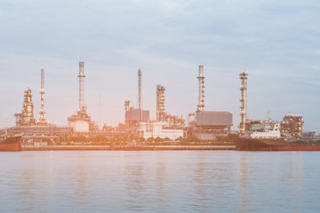 Fototapeta na wymiar Refinery oil manufacture river front, industrial background