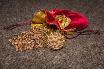Siberian pine nuts in a red pouch with a bump on shawls