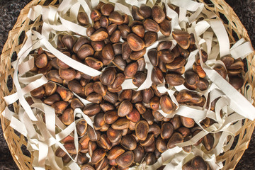 Siberian cedar nuts in a wooden basket