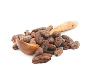 Wooden spoon of cocoa beans isolated