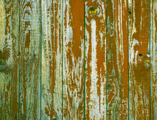 Fototapeta na wymiar Part of the door with a peeled red paint.