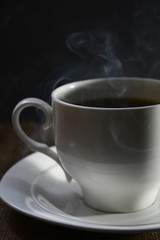 Cup of hot coffee with a king pair