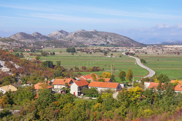 Fototapeta na wymiar Landscape with mountain village of Grab and road to city of Trebinje. Bosnia and Herzegovina