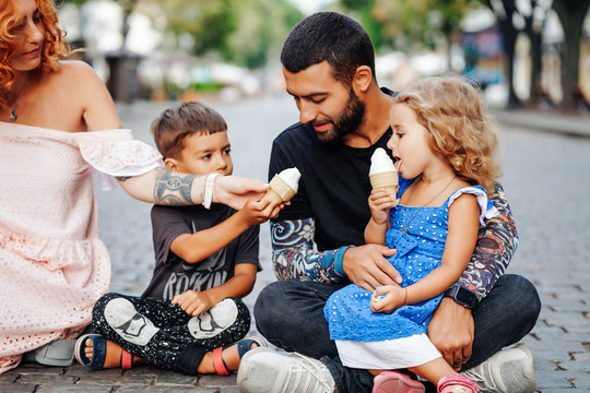 Beautiful Young Family With Ice Cream