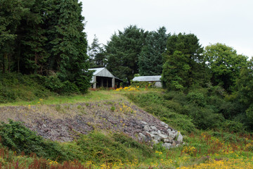 Two sheds built on top of a small hill