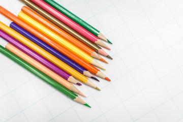 Fototapeta premium Colored pencils on white paper