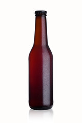 Brown glass beer bottle with black cap with dew
