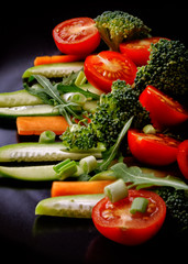 Salad with lettuce and fresh vegetable close up. Vertical image.