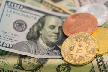 Bitcoins with US banknotes, golden bitcoin, silver bitcoin, bronze bitcoin