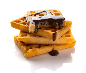 side view waffles with liquefied chocolate on a white background