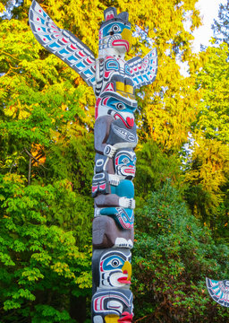 VANCOUVER, CANADA -september 2014: Wooden Haida Indian totem poles mark the boundary of the spirit world in Stanley Park, Vancouver, Canada.