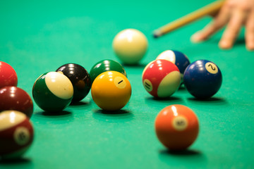 Billiards balls and cue
