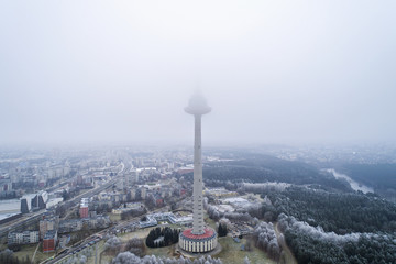 Aerial view over capital city Vilnius symbol TV Tower surrounded by old soviet time architecture in...
