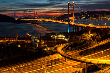 Fototapeta na wymiar Highway bridge over the sea with sunset